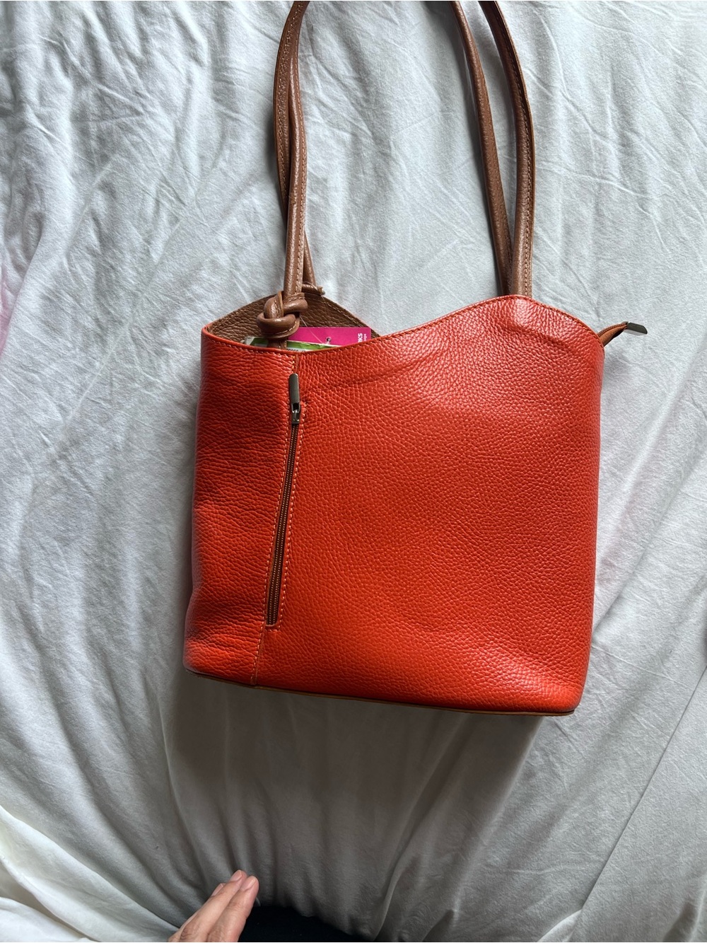 Pebbled Orange Shoulder Bag with Tan Straps also convert to back pack
